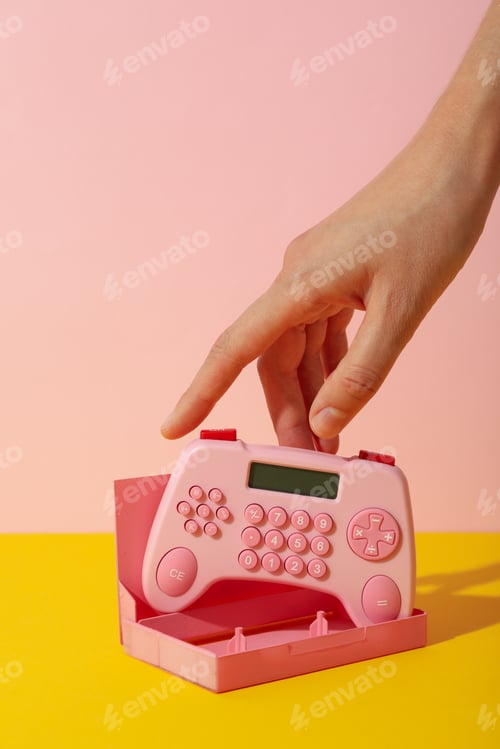 Preview: Cassette case and calculator in hand on pink background