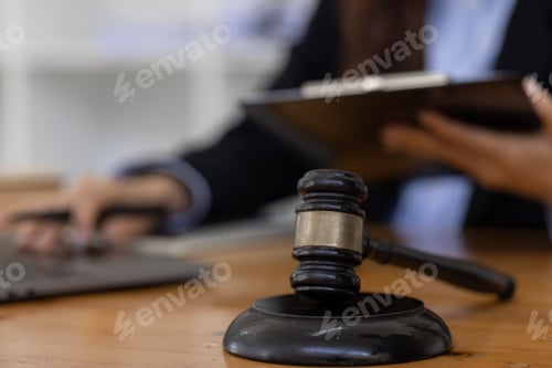 Preview: female business woman lawyers working at the law firms. Judge gavel with scales of justice. Legal