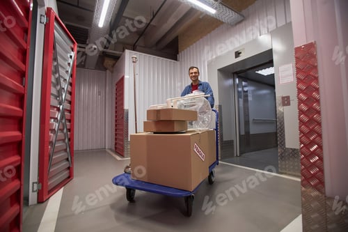 Preview: Man Pushing Cart in Storage Facility