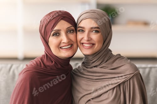 Preview: Portrait Of Muslim Woman And Adult Daughter In Hijab Indoor