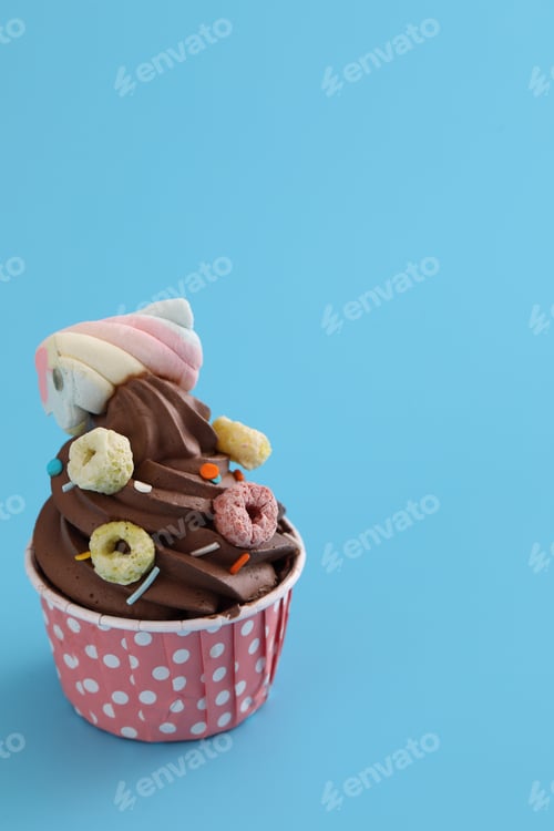Preview: Chocolate Cupcake Isolated In Blue Background