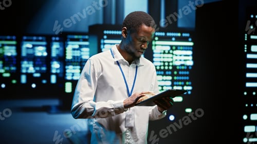 Preview: Technician walking through server rigs