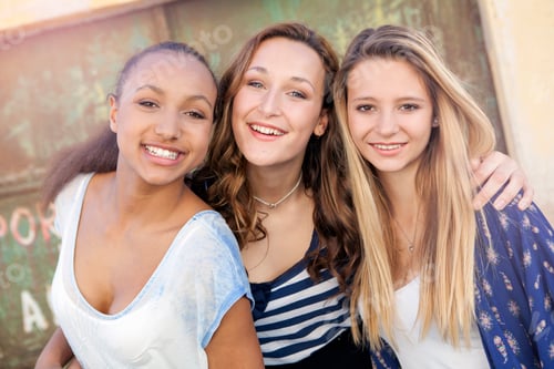 Preview: Teenage girls, metal door in background