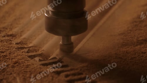 Preview: Carving geometric pattern on wooden sheet with small drill at woodwork factory, macro view. Creative