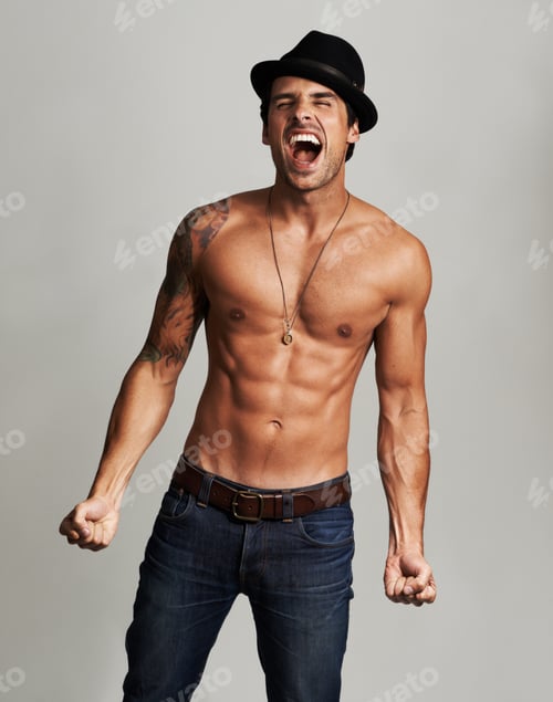 Preview: Shirtless frustration. A shirtless young man wearing a hat and screaming with his eyes closed.