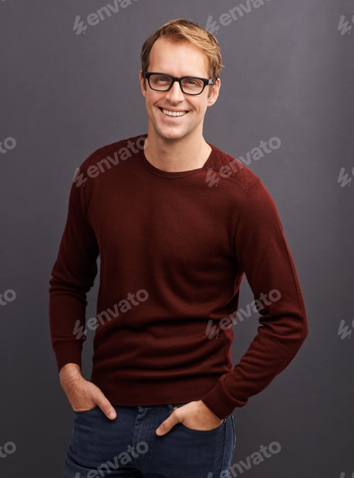 Preview: A great autumn look. A studio portrait of a handsome man wearing glasses.