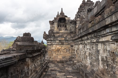 Preview: some stone statues near a walkway on a cloudy day?