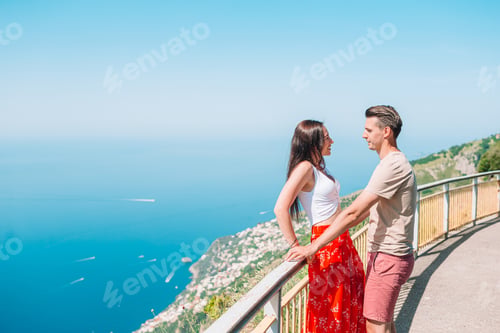 Preview: Summer holiday in Italy. Young man and woman in italian village on the background, Amalfi Coast