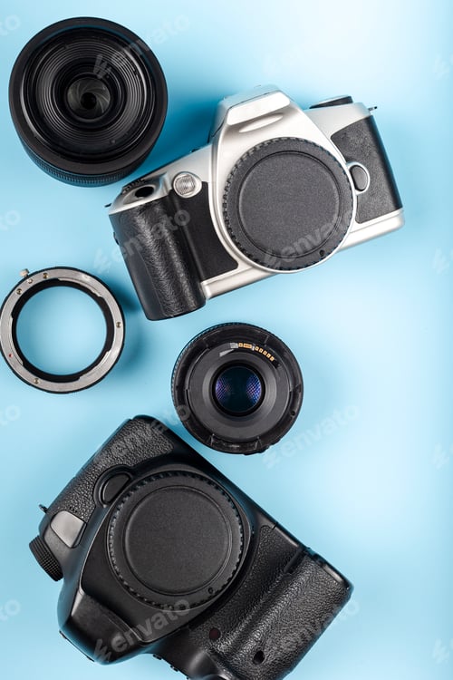 Preview: Flat lay of equipment for professional photographer on blue background. Photographer's Day Concept