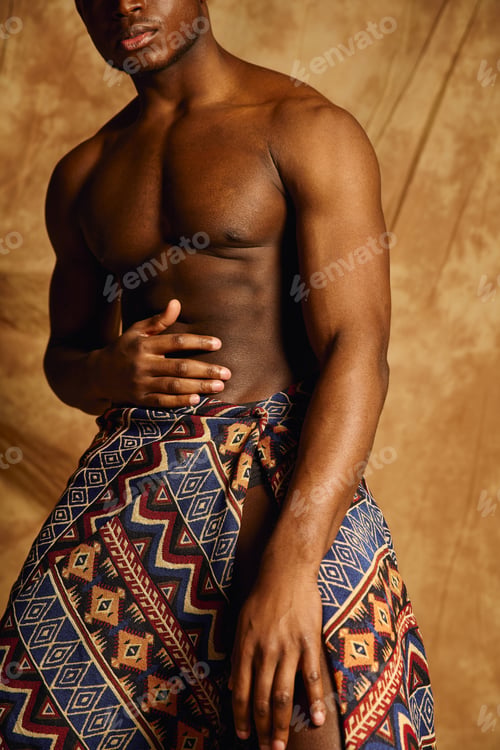 Preview: Confident young African American man posing with style in artistic setting