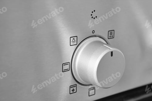 Preview: Oven cooking temperature control knob. Kitchen equipment panel detail. Stove