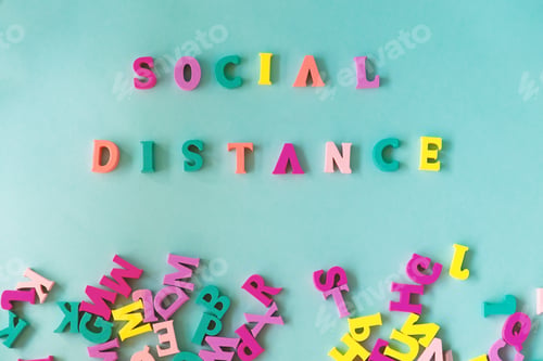 Preview: Flat lay of a bunch of wooden alphabet which some generated message Social Distancing