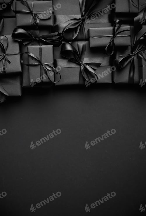 Preview: A pile various size black boxed gifts placed on stack. Christmas concept