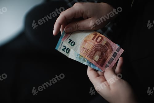 Preview: Euro Currency Notes Held in Hand Close Up