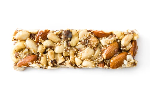 Preview: Protein bar with nuts, seeds and quinoa on white background