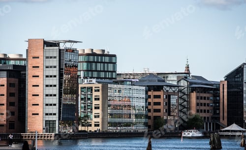 Preview: Beautiful shot of city buildings in the distance under a blue cloudy sky