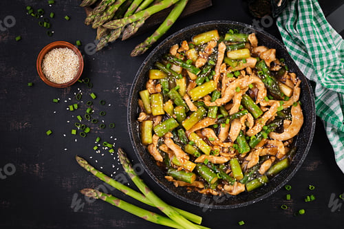 Preview: Stir fry with chicken and asparagus. Chicken stirfry. Chinese food. Top view, above