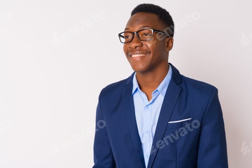 Preview: Face of young happy African businessman with eyeglasses thinking