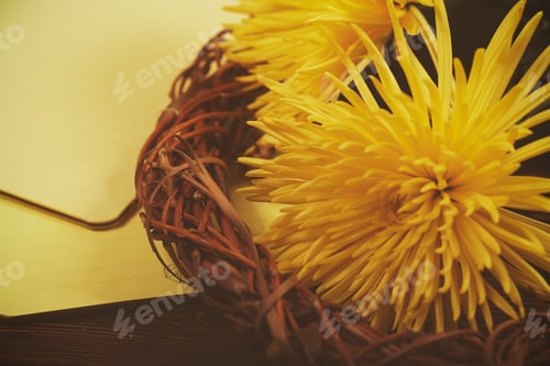 Preview: Notebook And Flowers Are On A Wooden Table