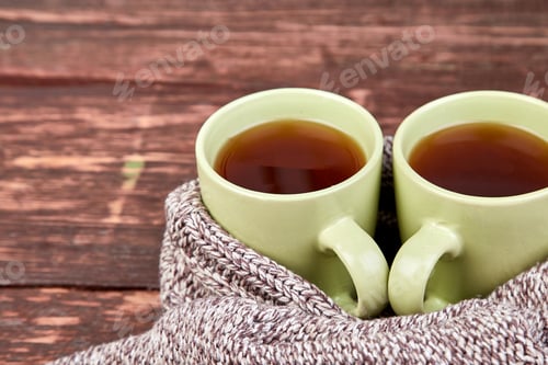 Preview: Two warm cups of tea, autumn leaves