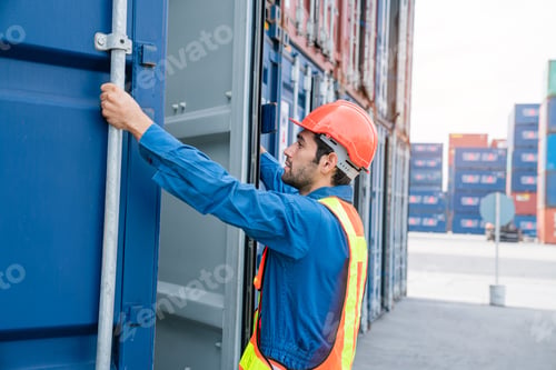 Preview: Male Container yard worker control and checking container at container yard warehouse.