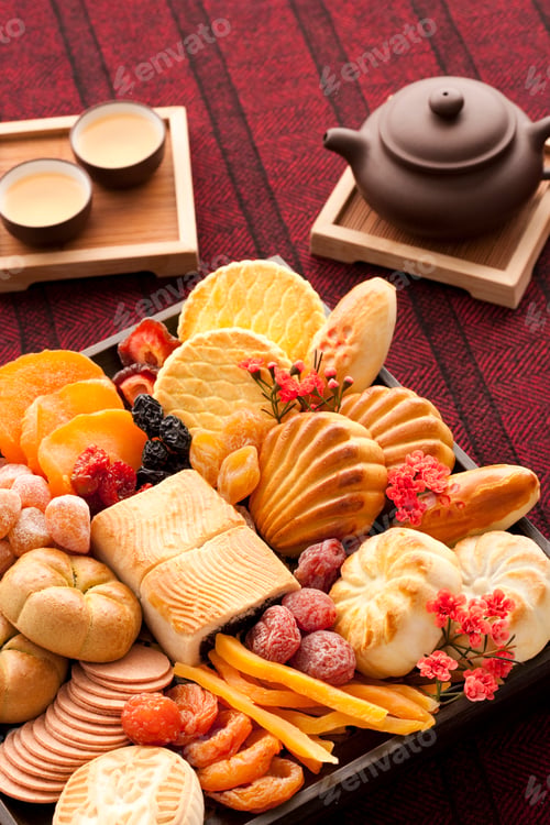 Preview: Chinese traditional dim sum and preserved fruits with tea