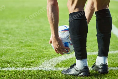 Preview: football player setiing the ball for game