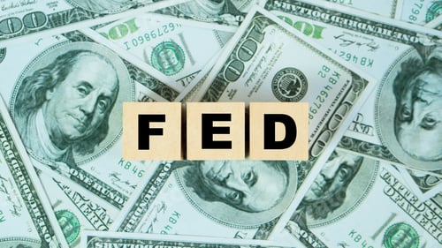 Preview: FED word on Wooden block with dollar backgound.The Federal Reserve to control interest rates.