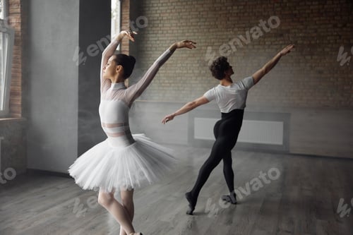 Preview: Two young ballet dancers wearing costume practicing together in studio class