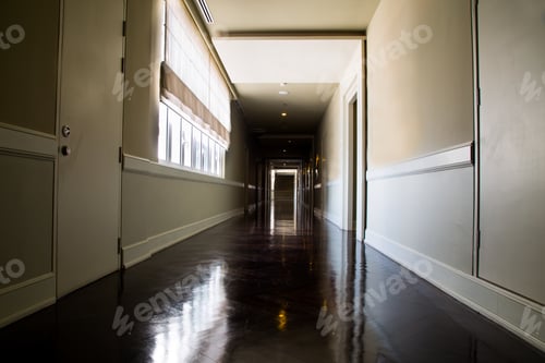 Preview: Dark and empty corridor with available natural light from window