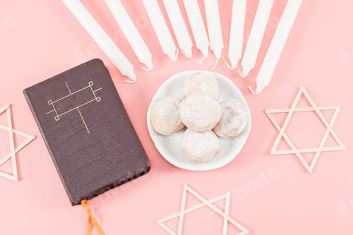 Preview: Donuts with powder in saucers, bible, nine white candles and three wooden stars of David on a pink .