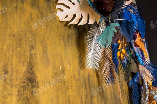 Preview: Creative layout with colorful tropical leaves on golden background. Minimal summer exotic concept