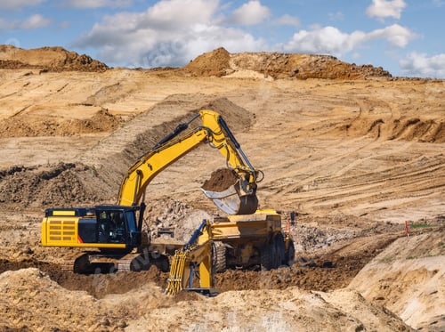 Preview: Yellow earth mover at a construction site