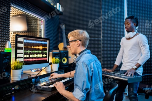 Preview: Two Men Working in a Music Recording Studio