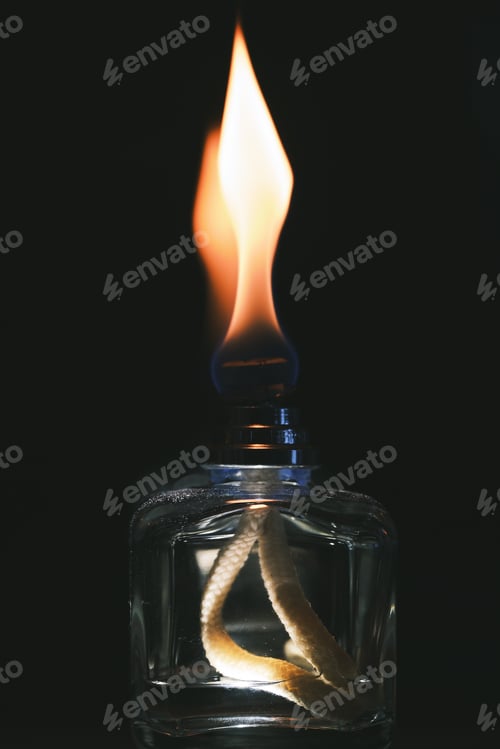 Preview: Vertical closeup shot of an alcohol burner on a black background