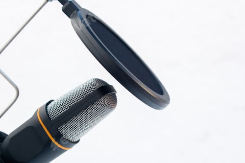 Preview: Closeup of a black and grey microphone captured on a white background