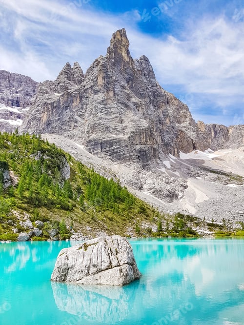 Preview: Spectacular rocky mountain peak above idyllic emerald lake Sorapis in italy.