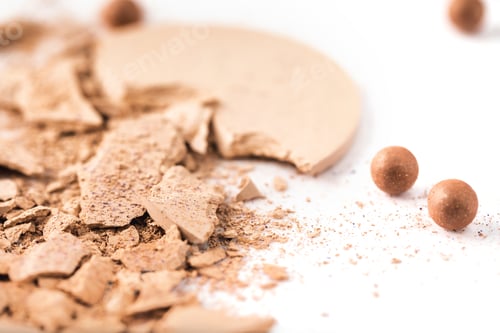 Preview: close-up shot of cracked cosmetic powder isolated on white