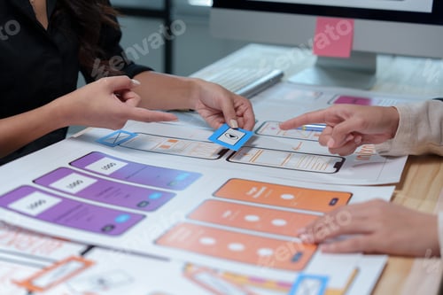 Preview: Web designers are discussing user experience and user interface details for a new mobile application