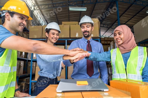 Preview: Group of Diversity warehouse worker throwing helmets when success the project and celebrating