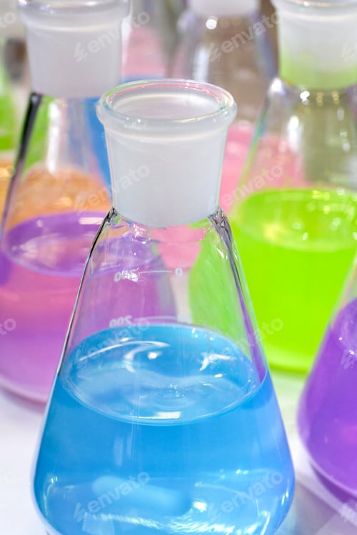 Preview: Multi-colored liquids in chemical laboratory conical flasks