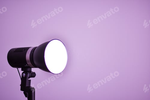 Preview: Studio flash light on a tripod stand isolated on very peri background