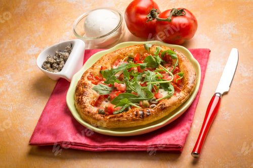 Preview: pizza with fresh tomatoes mozzarella arugula and capers