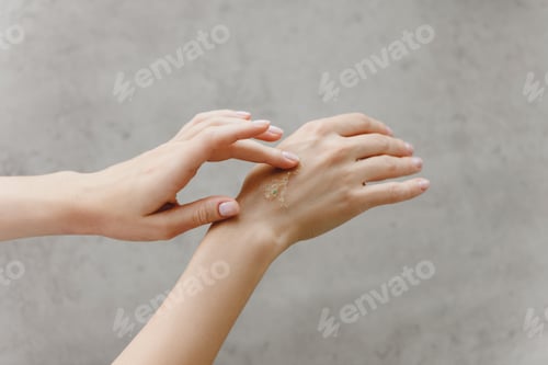 Preview: Woman hands with body scrub. Self care concept.