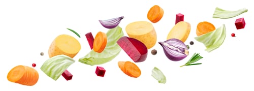 Preview: Falling pieces of different vegetables isolated on white background