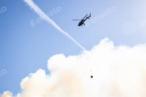 Preview: Helicopter fighting BC forest fires during a hot sunny summer day