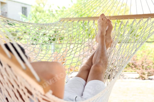 Preview: Man Relaxing in Hammock on Sunny Day