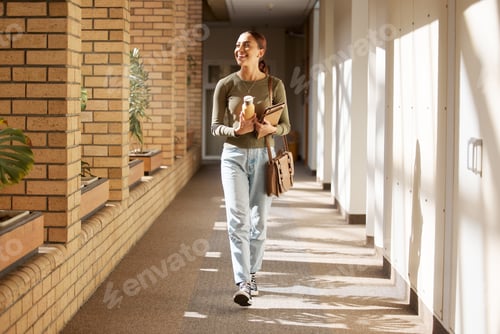 Preview: Woman, student and university hallway with a person walking ready for learning and study. Smile, co