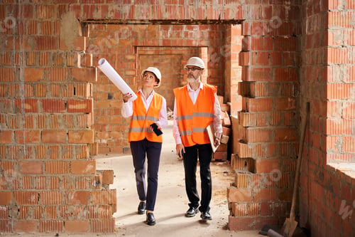 Preview: Construction manager and contractor inspecting interior of building