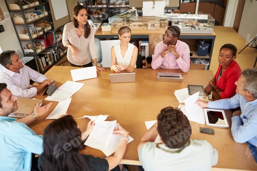 Preview: Architects Sitting At Table Meeting With Laptops And Tablets